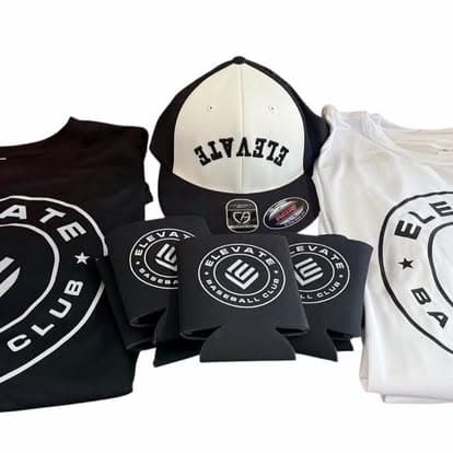 A custom bundle of an embroidered cap, tees, and koozies on a white surface.